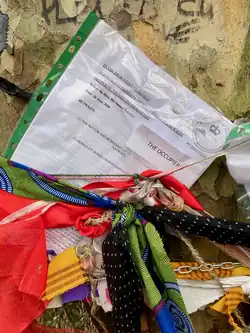 High court injunction documents tied to tree