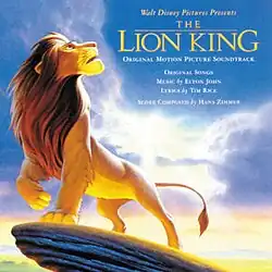 A picture of adult Simba standing on top of Pride Rock and next to him says "Walt Disney Pictures presents," and then below, the title of both the film and the soundtrack and shows that the songs were written by Elton John, the lyrics were written by Tim Rice and the music score was composed by Hans Zimmer.
