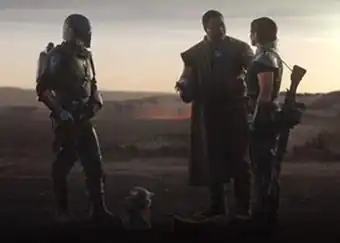 Four protagonists from The Mandalorian stand on rocky terrain, with volcanic embers and an evening horizon visible behind them.