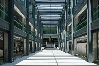 The atrium of Unit 6 uses a large amount of glass and features skylights to bring in natural light.