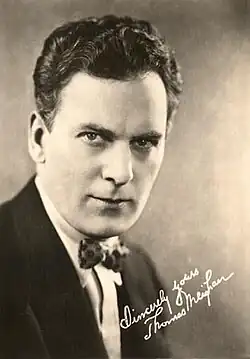 Black and white portrait photograph of a man in early 20th century formal attire