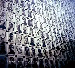 A memorial with pictures of people assorted in a grid.