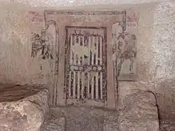 Painted false door; the "hammerhead" surround is a frequent motif