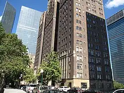 Looking north from 41st Street along the west side of Tudor City Place. Prospect Tower and Tudor Tower are across the street to the right. The glass buildings at One and Two United Nations Plaza are visible in the background, and the UN Secretariat Building, which also has a glass facade, can be seen at right.