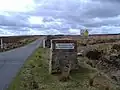 Signpost for Otterburn Crossroads on the MoD ranges