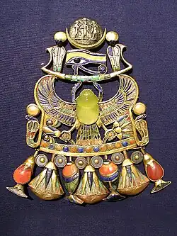Pectoral (chest jewellery) of Tutankhamun; 1336–1327&nbsp;BC (Reign of Tutankhamun); gold, silver and meteoric glass; height: 14.9&nbsp;cm; Egyptian Museum (Cairo)