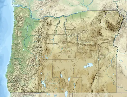 A map of Oregon showing different counties with a red dot in the southwestern section