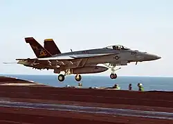 NK-200, the CAG Bird of VFA-115, launch from the USS Abraham Lincoln (CVN-72) on 9 October 2002.