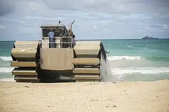 Ultra Heavy-Lift Amphibious Connector lands on the shore after disembarking USS&nbsp;Rushmore with heavy equipment during a Marine Corps Advanced Warfighting Experiment during RIMPAC 2014. The prototype is a ship-to-shore connector and is 50% scale.