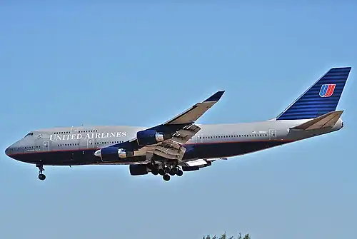 A Boeing 747-400 at Los Angeles International Airport wearing "Battleship" livery (1993–2004)