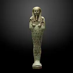 Ushabti; 360–343&nbsp;BC; ceramic and enamel; 26.7 × 7.1&nbsp;cm; from Saqqara; Museum of Art and History (Geneva, Switzerland)