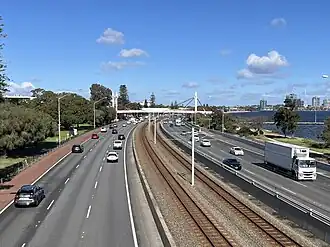 The freeway and railway viewed from a bridge