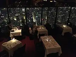 South-facing view showing patrons dining in The Signature Room at night in 2018