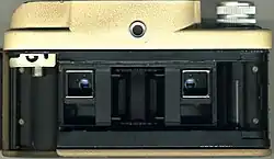 View of the back of the camera with the film chamber visible. With the selector in the B position, the lenses are pointing to the top half of the film.