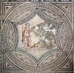 Top-down view of an elaborate geometric mosaic with a circular inset showing Bacchus encountering the sleeping Ariadne