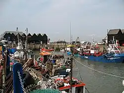 Several boats docked at a harbour