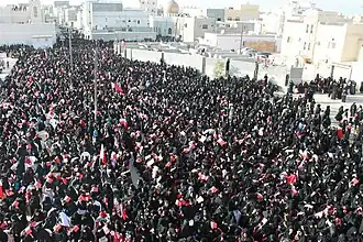 Women taking part in a pro-democracy sit-in in Sitra
