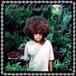 A photo of Dayes as a youth standing in a garden