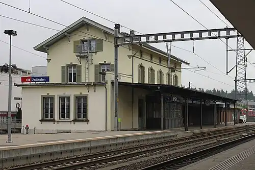 Three-story building with gabled roof
