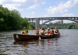 Group paddling a canoe