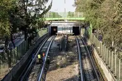 Technicians are inspecting the tracks of the line near the station.