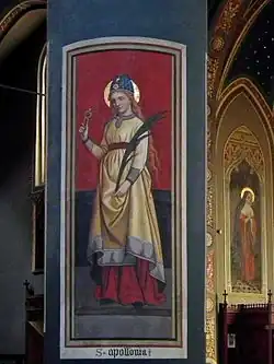 Apollonia van Alexandrië met tang en palmtak (Piëmont, Italië)