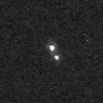 Opname van Altjira en zijn begeleider door Ruimtetelescoop Hubble