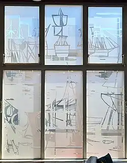 Kompaszaal: gegraveerd raam