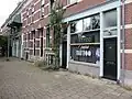 Atelier aan Branco van Dantzigstraat naast Tattooshop in 2024.