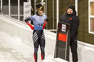 Li Yuxi bij de finish van heat 4 tijdens het IBSF wereldkampioenschap skeleton 2025