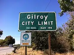 Plaatsnaambord in VS met populatieaanduiding