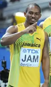 Michael Frater na de gewonnen 4 × 100 m tijdens de WK van 2009, Berlijn.