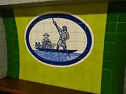 Het tegelmotief met het voetveer, veerman en reiziger.