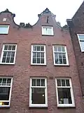 Huis vanwege de zandstenen afdekkingen van de klokvormige top