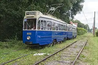 Een drieasserstel als museumtram bij de EMA.