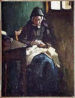 Zittende vrouw in Terschellinger klederdracht