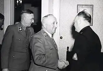 Ritterbusch (met bril) op bezoek bij Anton Mussert (Utrecht, febr. 1944)