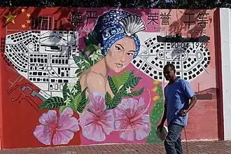 Muurschildering in Suffisant ter nagedachtenis van het Chinezenconflict gemaakt door Avantia Damberg