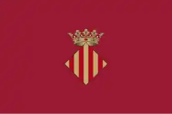 Vlag van Xàtiva met donkerrode achtergrond.