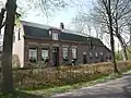 Boerderij opgetrokken in ambachtelijk-traditionele stijl