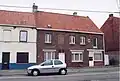 Eenheidsbebouwing van een enkelhuis en een winkel-woonhuis