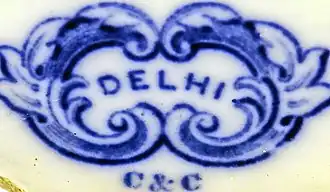 Beeldmerk op een bord van de aardewerkfabriek Clermont & Chainaye (C&C)