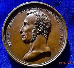 Willem I in maart 1815 als koning der Belgen en groothertog van Luxemburg op een bronzen medaille van Michaut, voorzijde.
