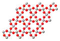 Schematische weergave van de structuur van kwarts. Rood is zuurstof en grijs is silicium