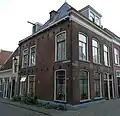Onder- en bovenwoning en gasthuisrestant