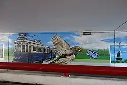 Blauwe Tram afgebeeld onder station De Vink.