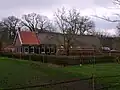 Boerderij met achterbaander en woondeel met rechte eindgevel