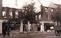 Verwoeste winkelpanden aan de Annastraat in 1942.