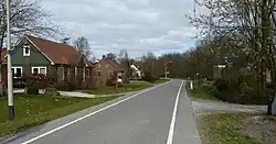 Huizen aan de weg door Breede