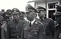 Werkbezoek van Heinrich Himmler (vooraan) aan KZ Mauthhausen in april 1941, met van links naar rechts August Eigruber, Franz Ziereis, August Schmidhuber, Himmler, Karl Wolff en Franz Kutschera.